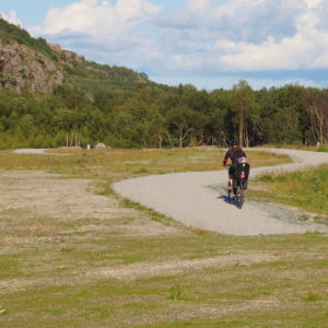 Austrått area, Rusaset, mansion paths of Austrått, a woman with a child on a bike on a bicycle path