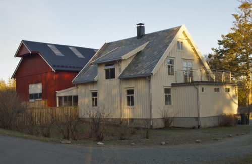 Austrått, Austrått agrotourism, white house and a red barn to the left